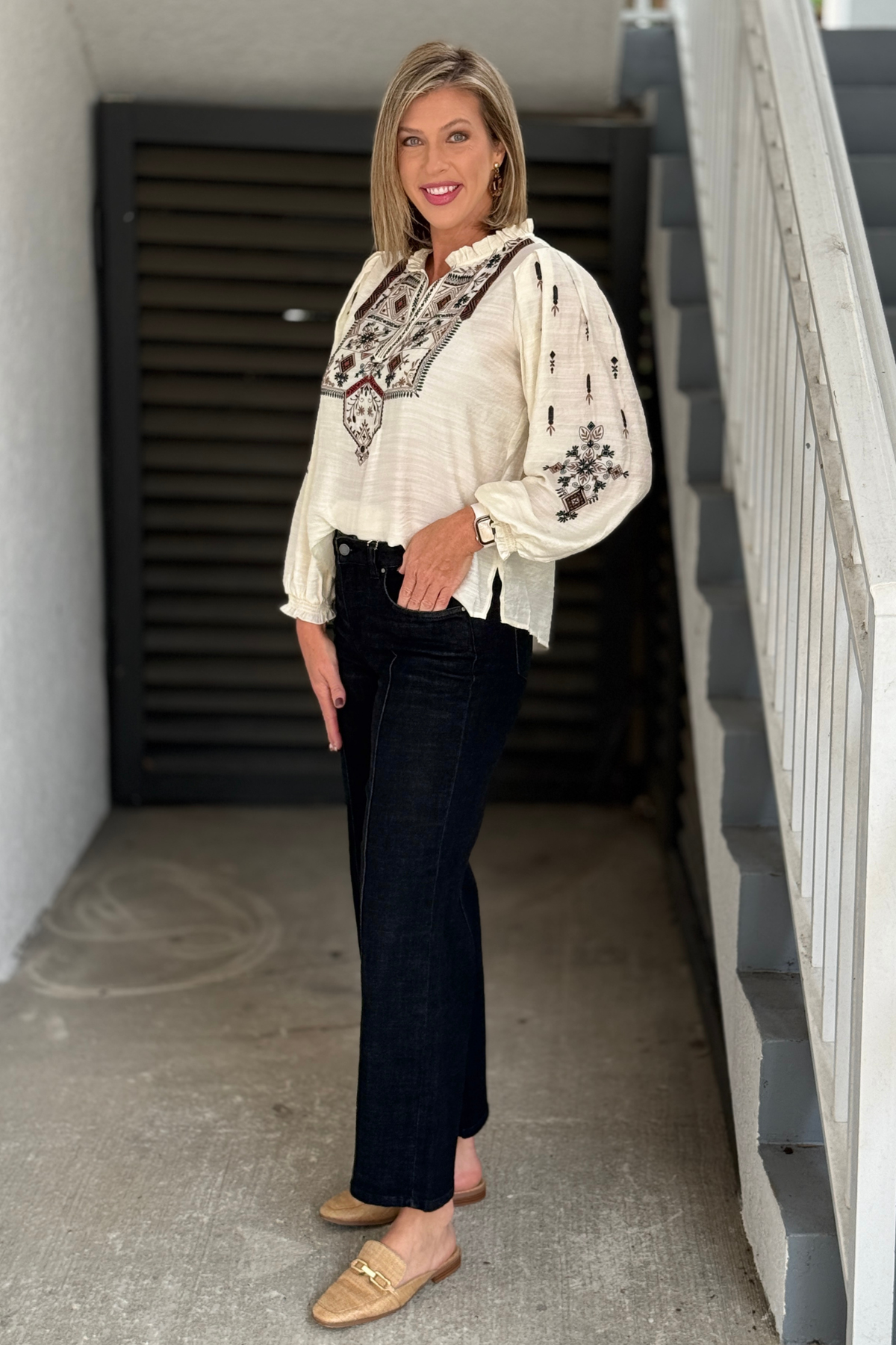 Side view of FDJ Olivia black mid rise wide leg jeans