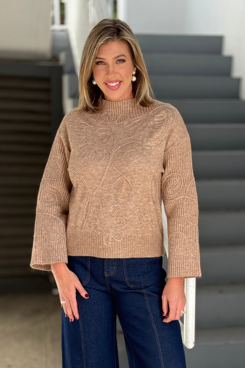 Women’s light camel mock neck sweater with abstract embroidery