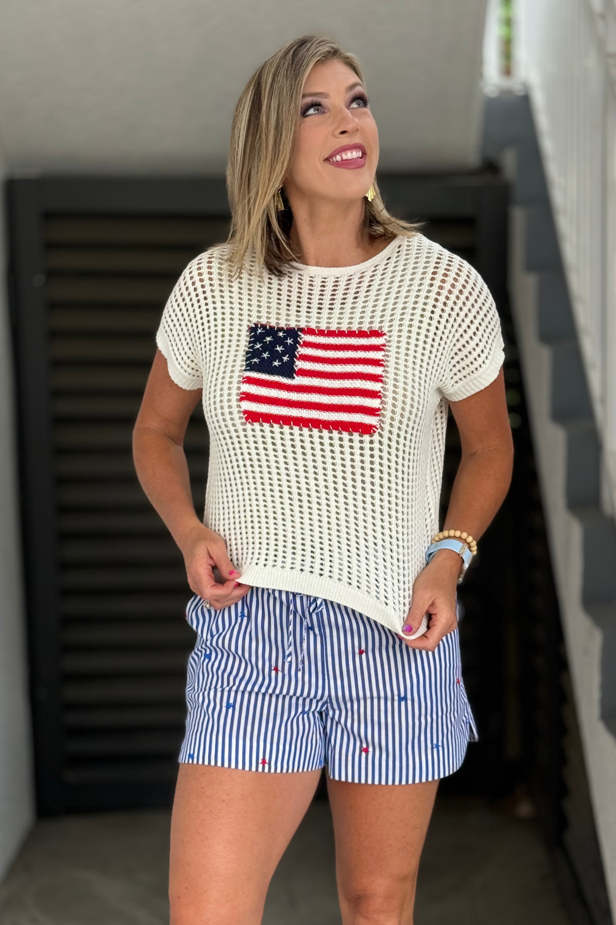 Ivory open knit sweater with American flag graphic