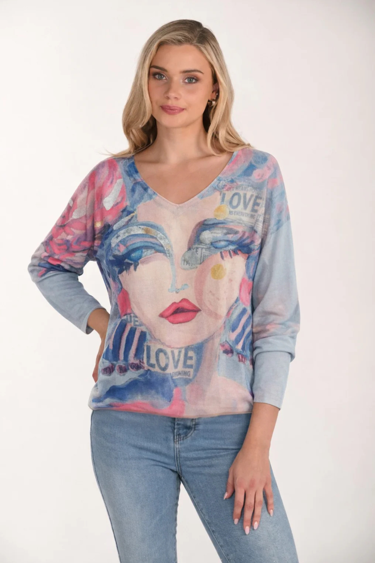 Women wearing Frank Lyman artistic V-neck knit top