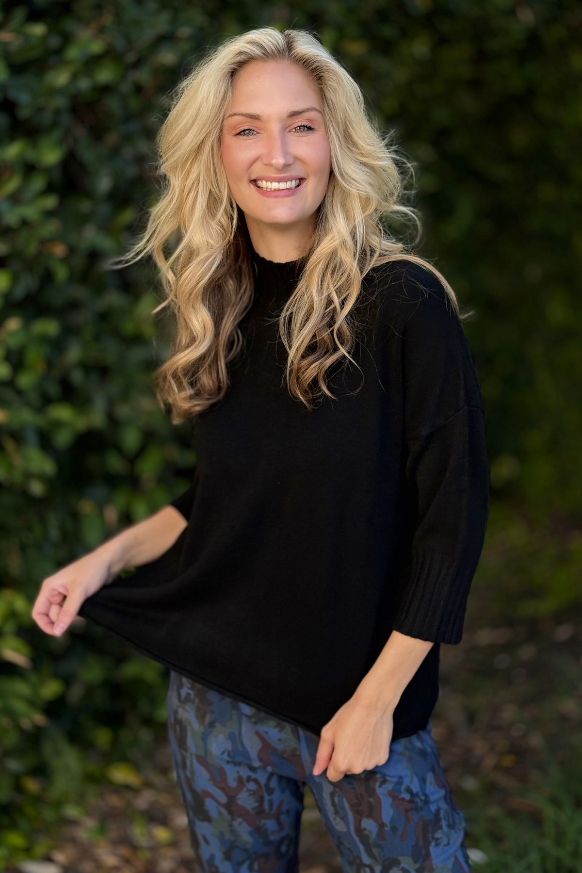 Flora Ashley Mock Neck Knit Sweater in black styled with leopard print pants