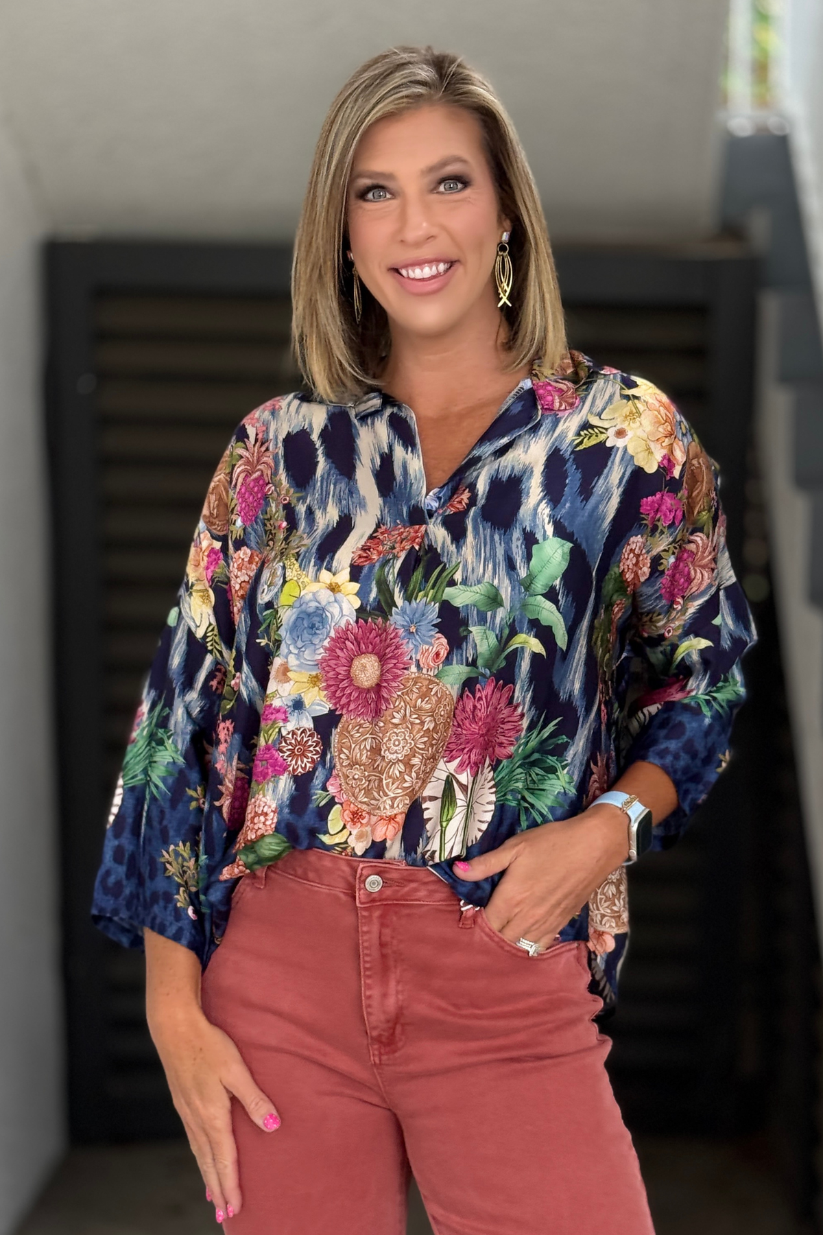Blue botanical mixed print blouse front view