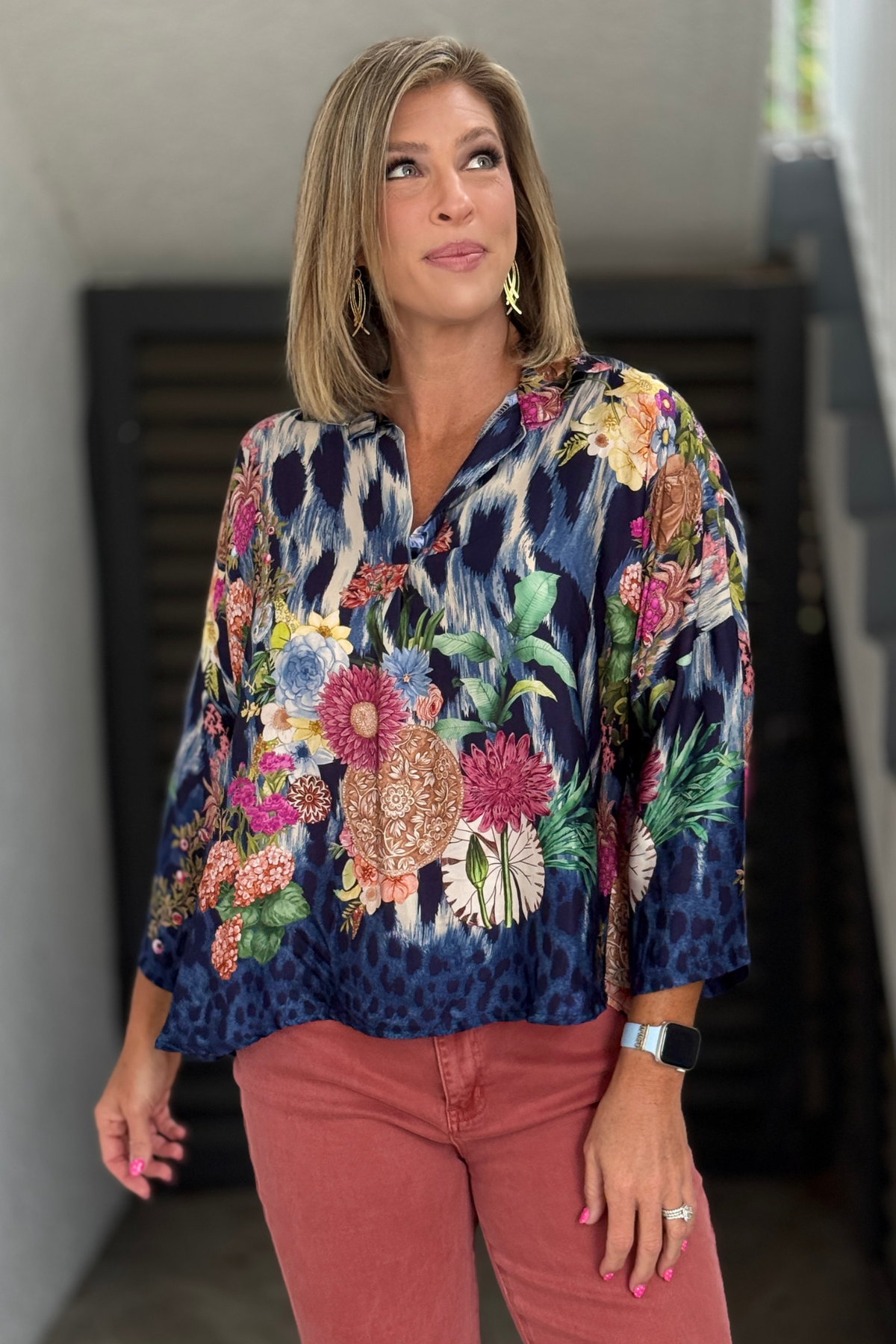 High-low collared blouse styled with colored denim