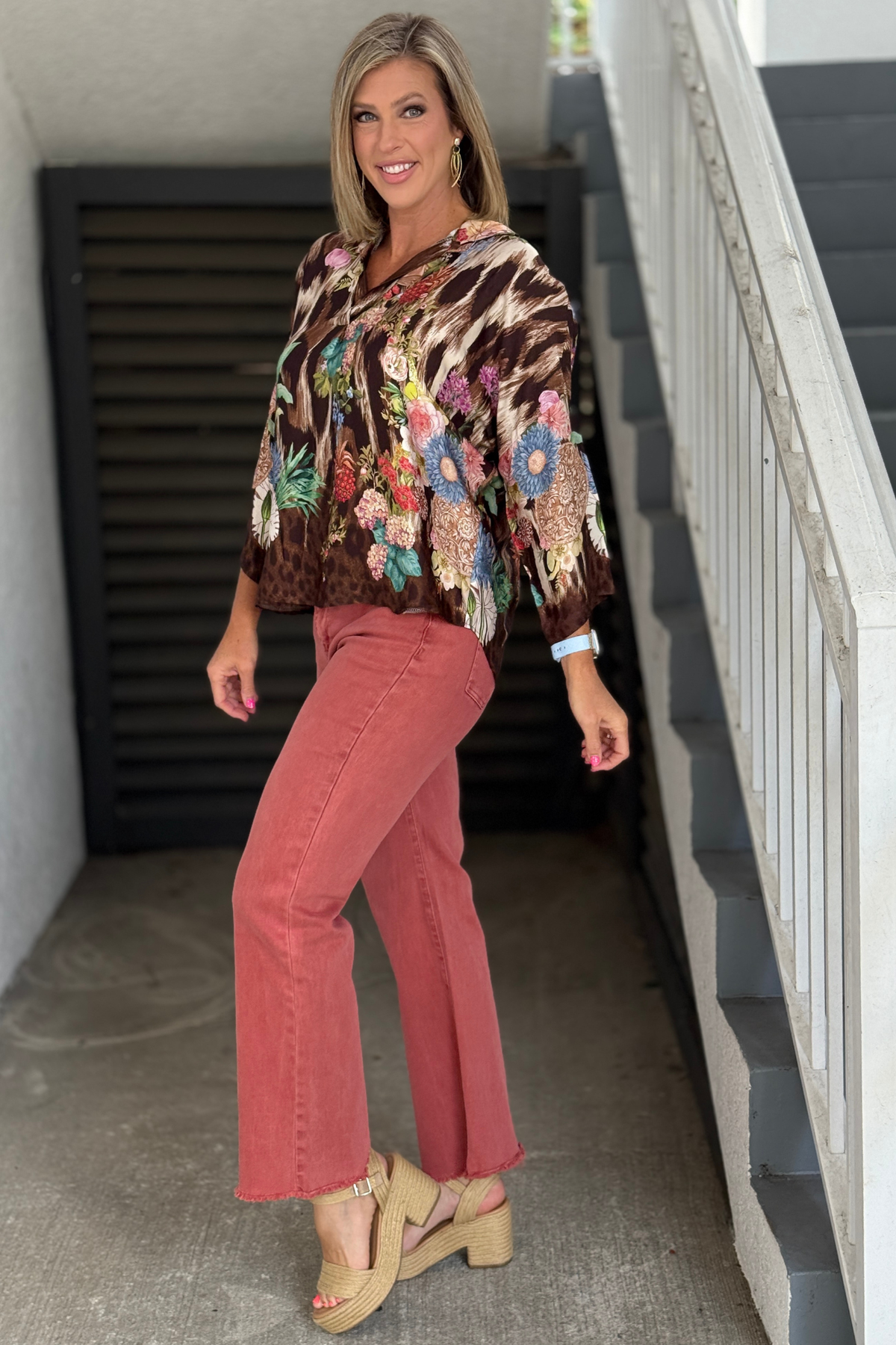 High-low collared blouse styled with colored denim