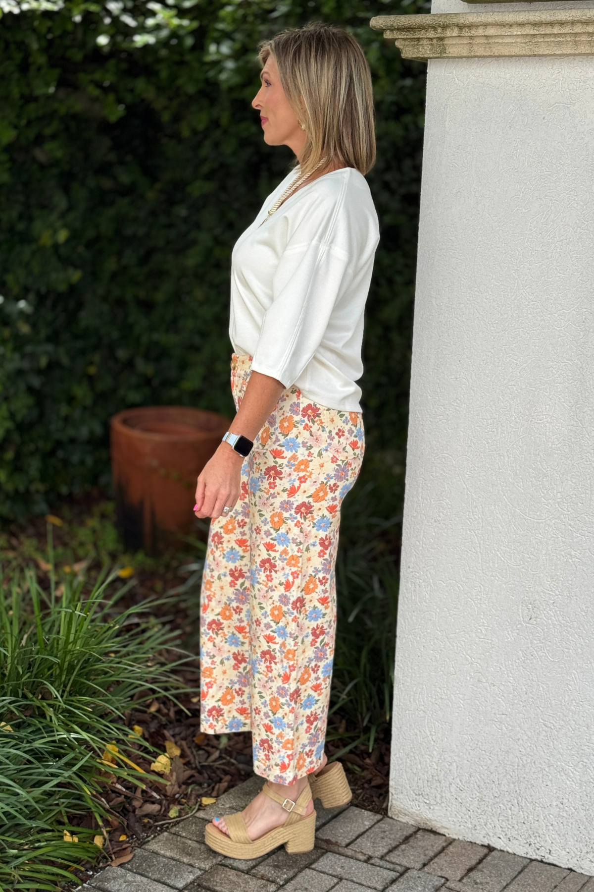 Pastel floral print denim pants with wide leg fit