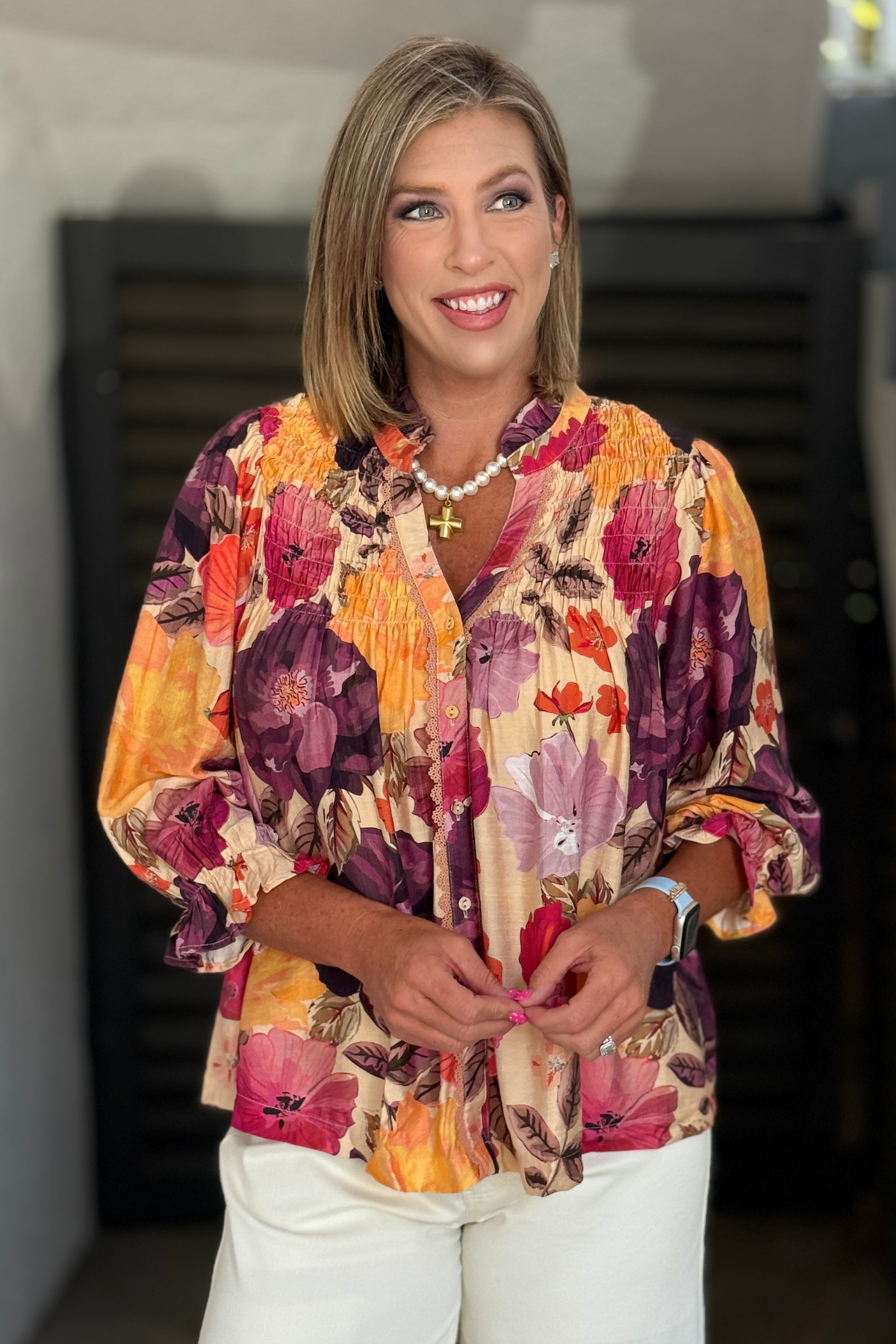 Women's watercolor floral blouse with smocked shoulder detail