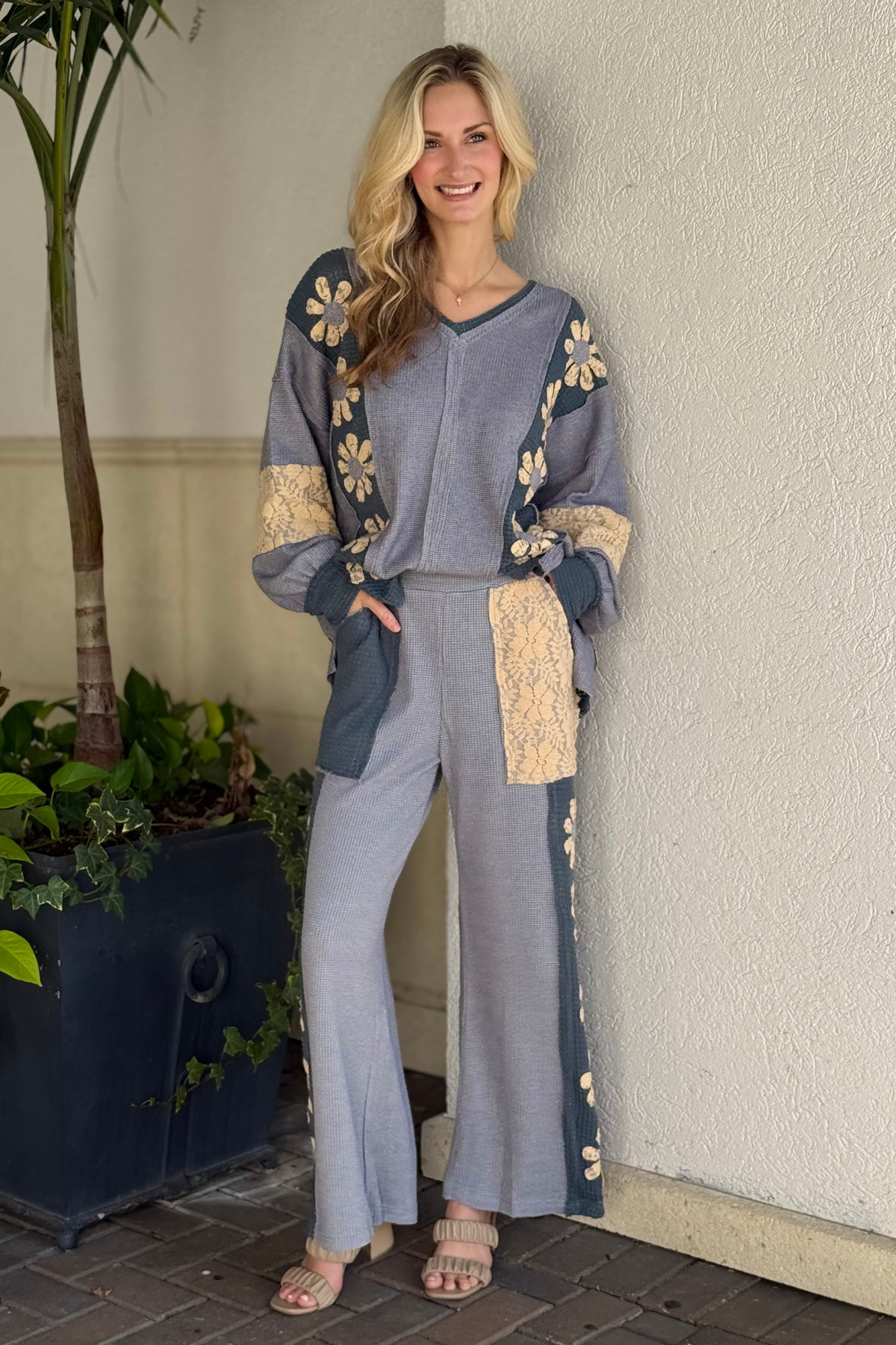 Boho slate blue knit pants with floral lace appliqué