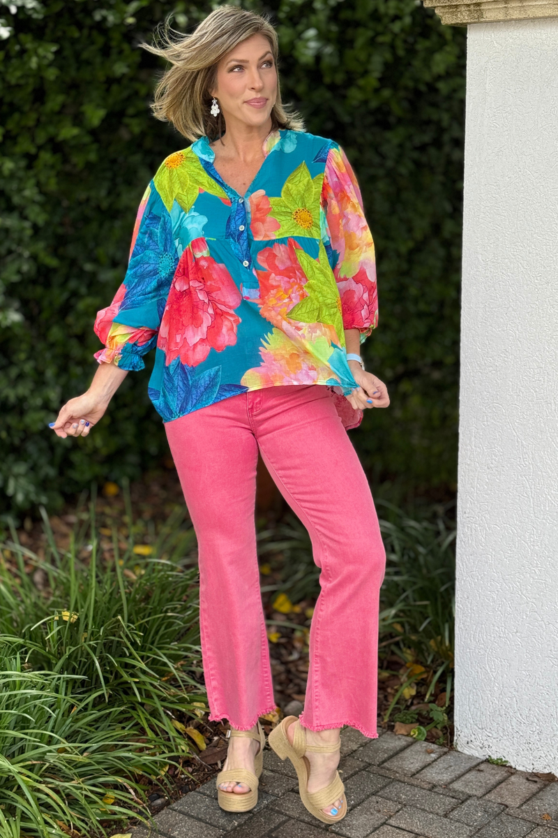V neck floral blouse with oversized sleeves and bright spring colors