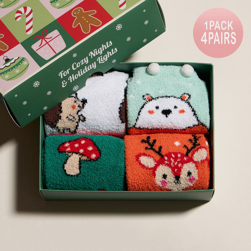 Four-pair fuzzy Christmas socks set with reindeer, bear, hedgehog, and mushroom festive designs.