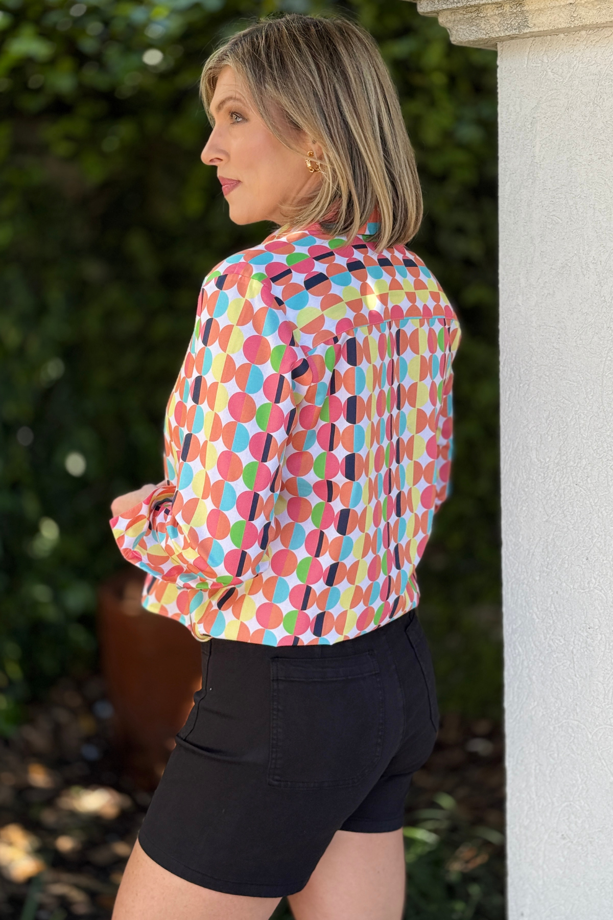 women’s button down retro print top styled with black shorts