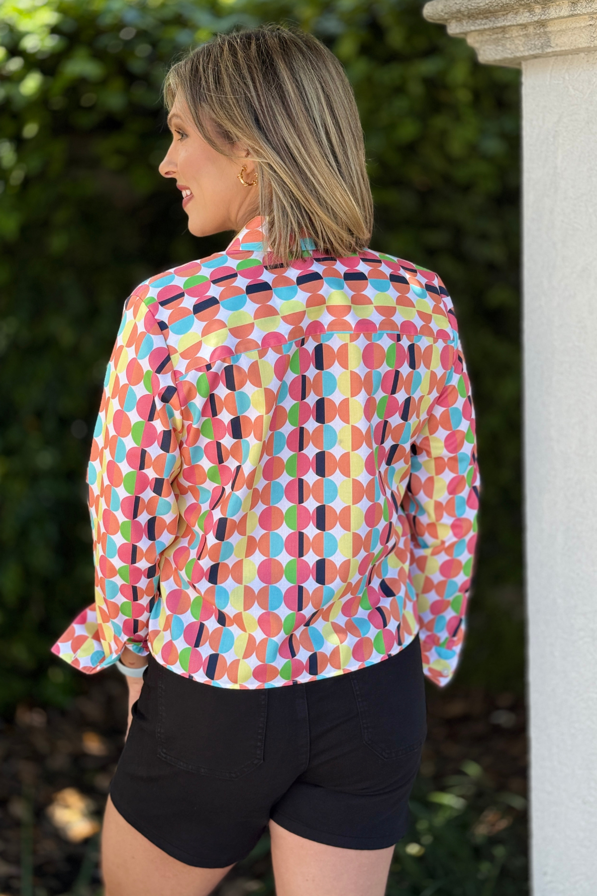 bright patterned blouse with structured collar