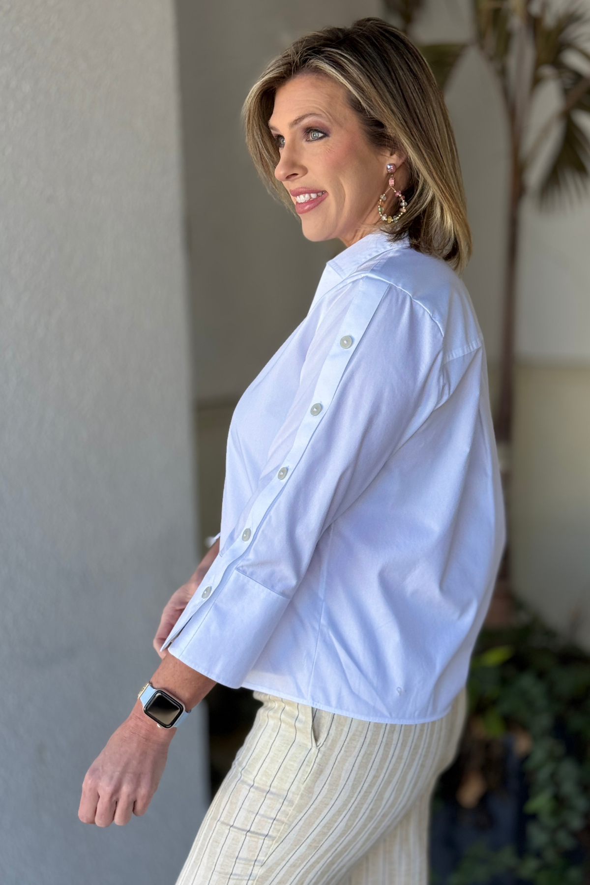 Women’s polished white shirt with sleeve button detail