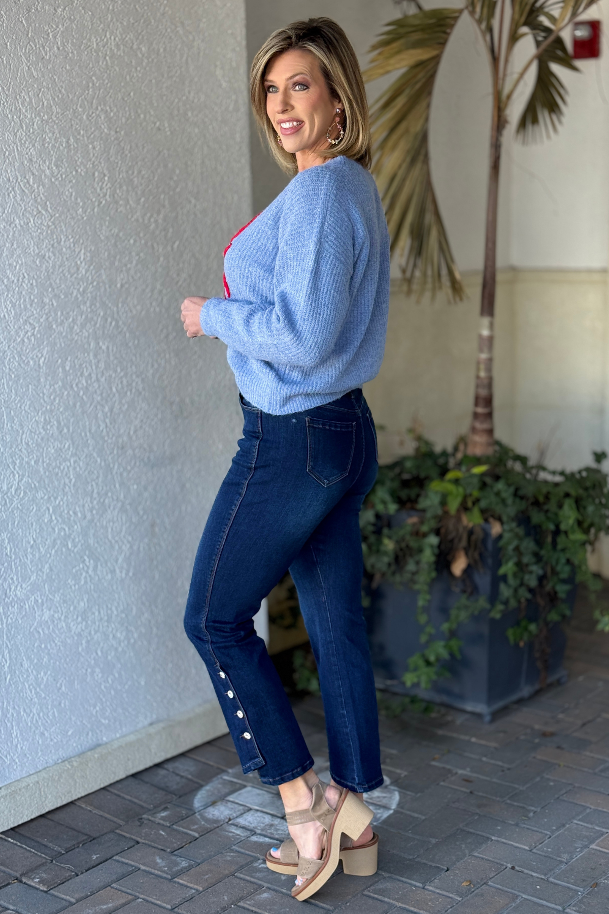 Luxury women’s slim fit jeans with side button detail