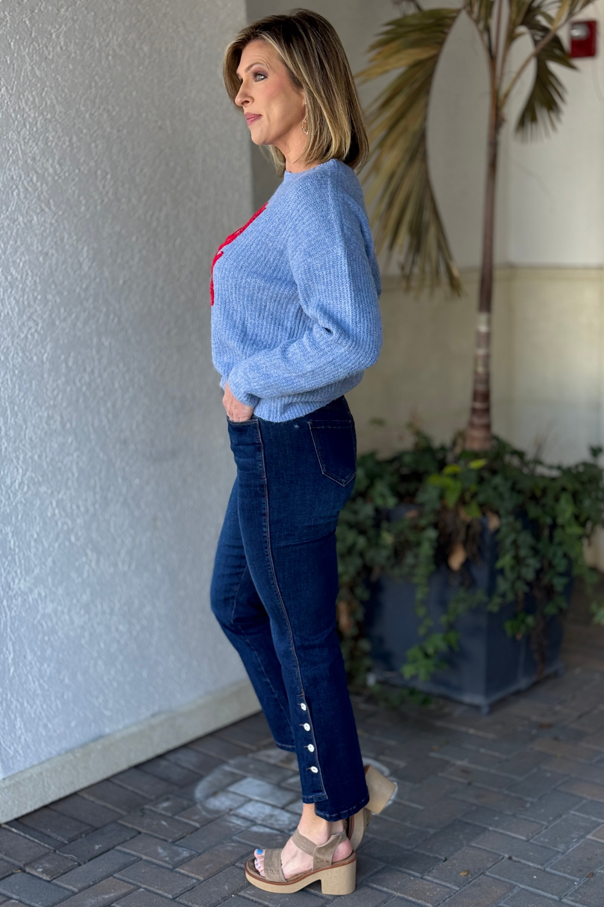 Close up of decorative button embellishments on designer denim