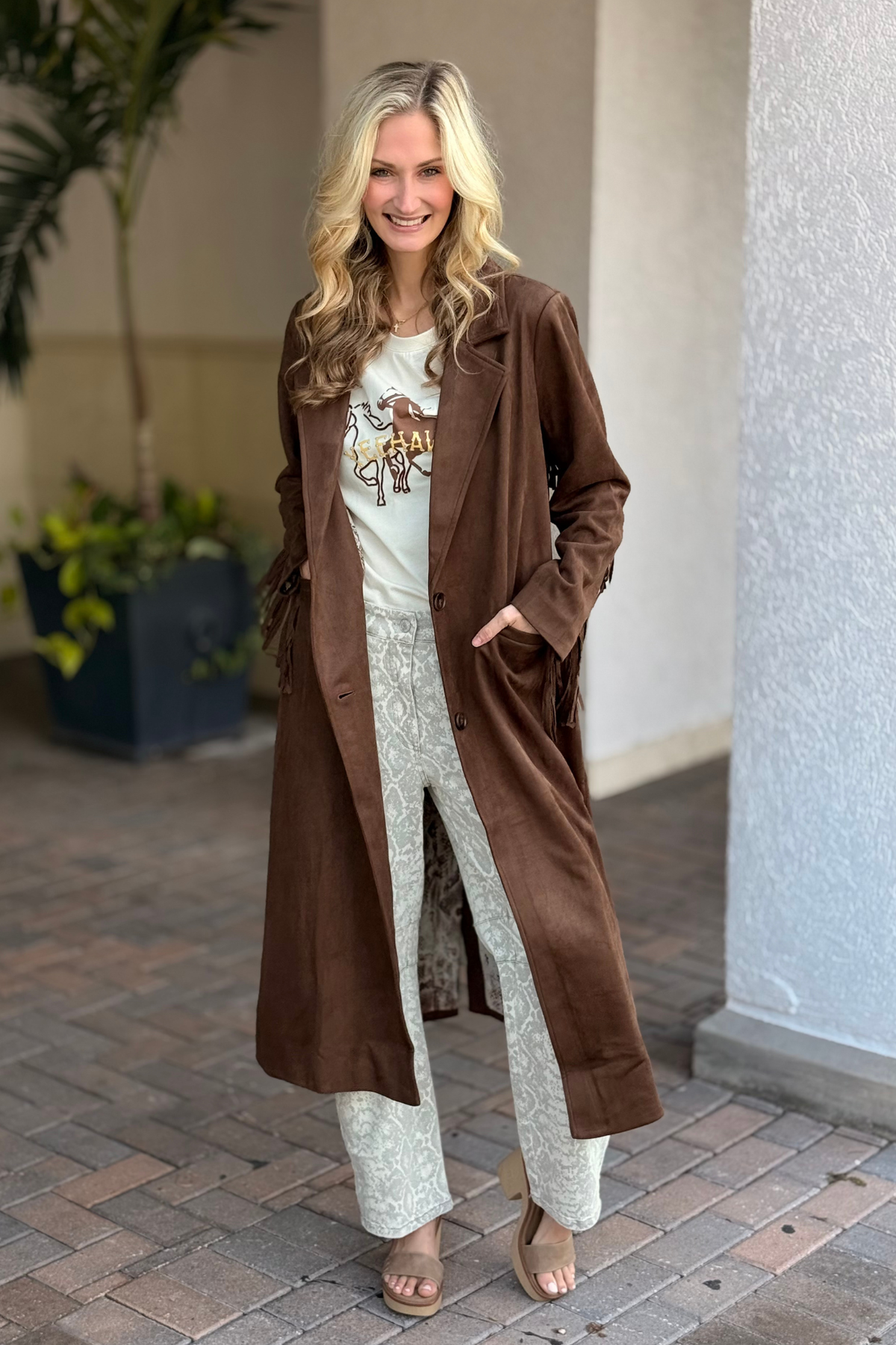Western-style fringe coat on model