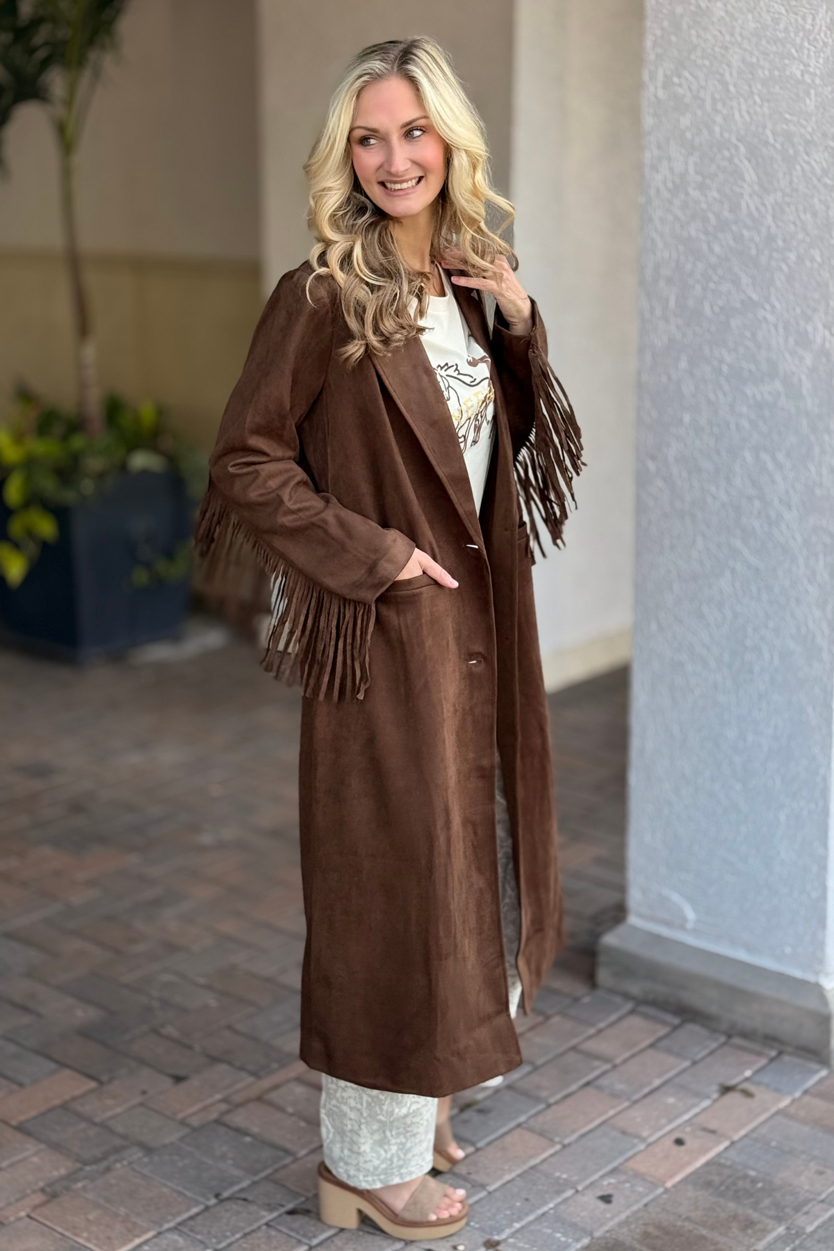 Long brown suede coat with sleeve and back fringe