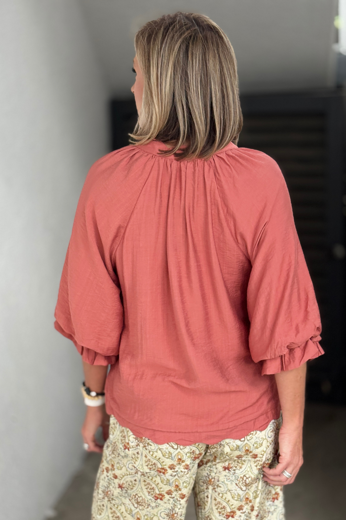 Canyon Clay blouse back view with gathered neckline detail