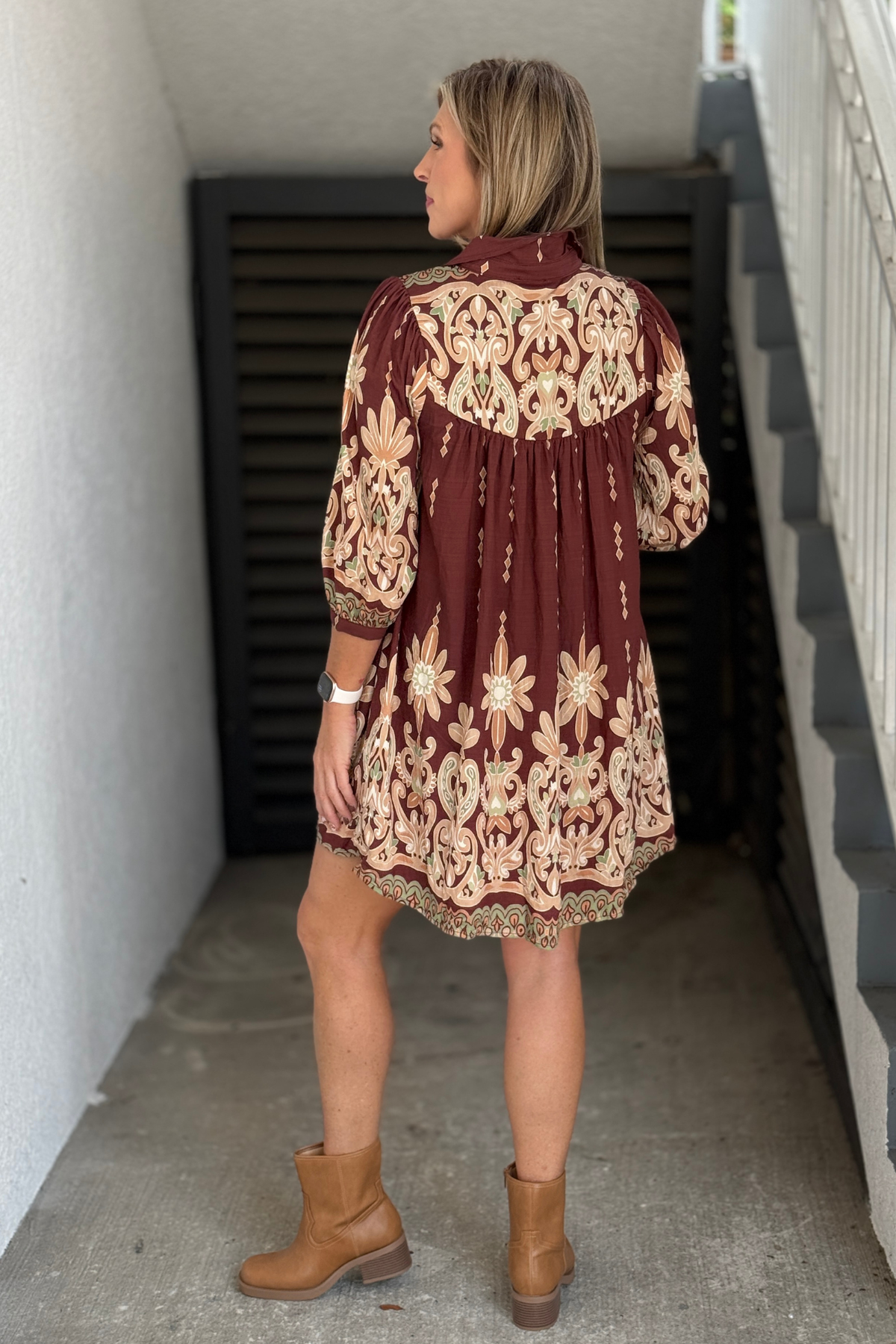 Brown printed fall dress styled with ankle boots