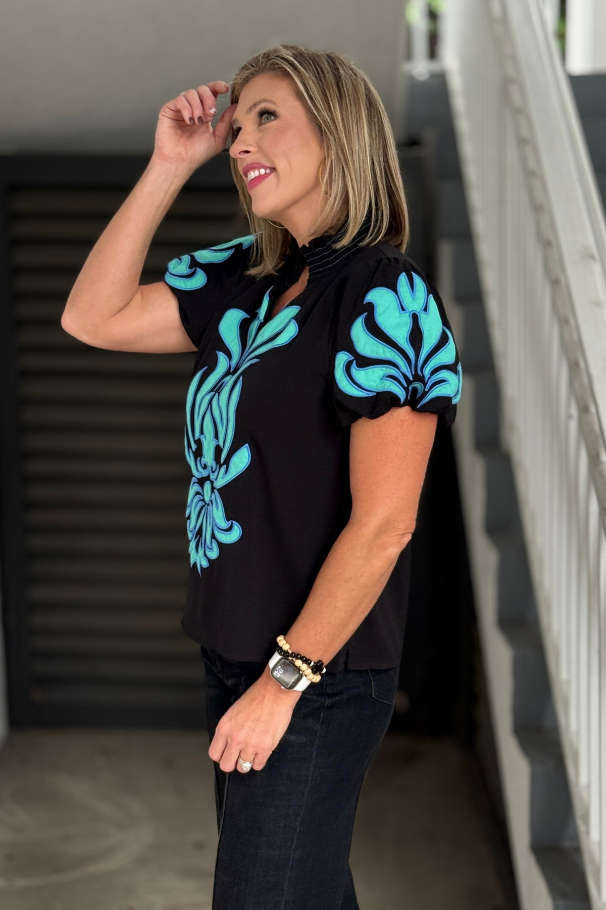 Turquoise appliqué detail on black short sleeve boutique blouse