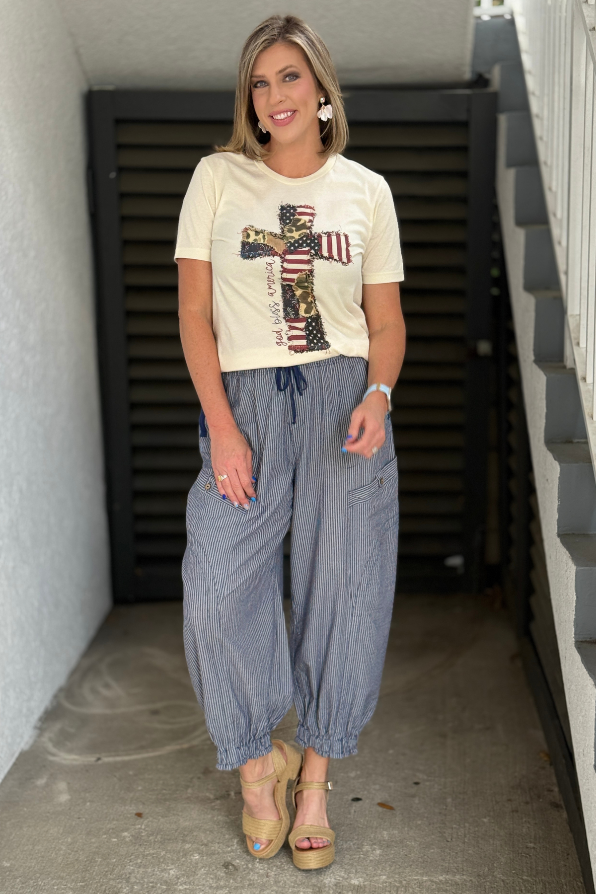 navy striped parachute pants with drawstring waist and elastic ankle