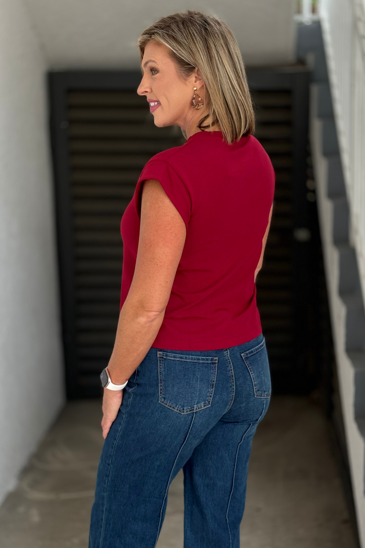 Burgundy cap sleeve top styled with dark wash denim