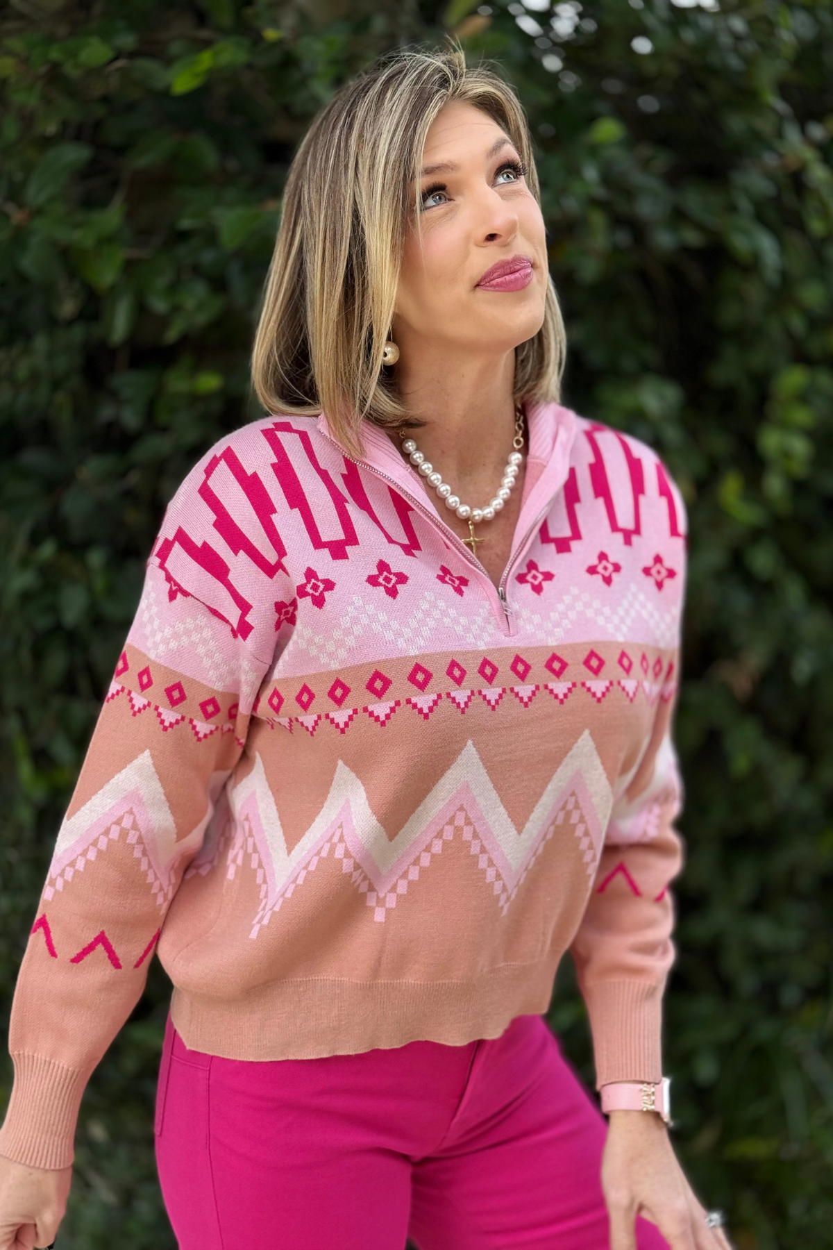 Model styling relaxed fit pink geometric sweater