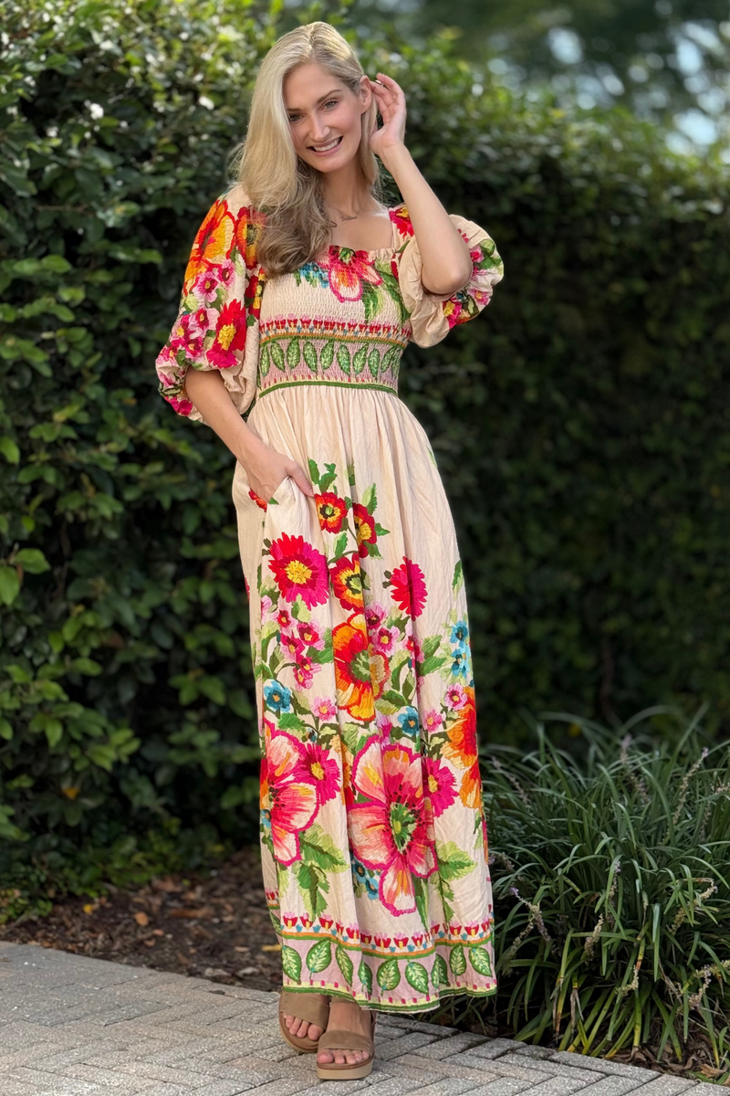 Close-up of smocked bodice and square neckline on floral maxi dress