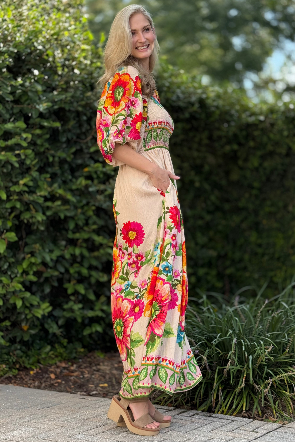 Full-length view showing vibrant floral border print at hem