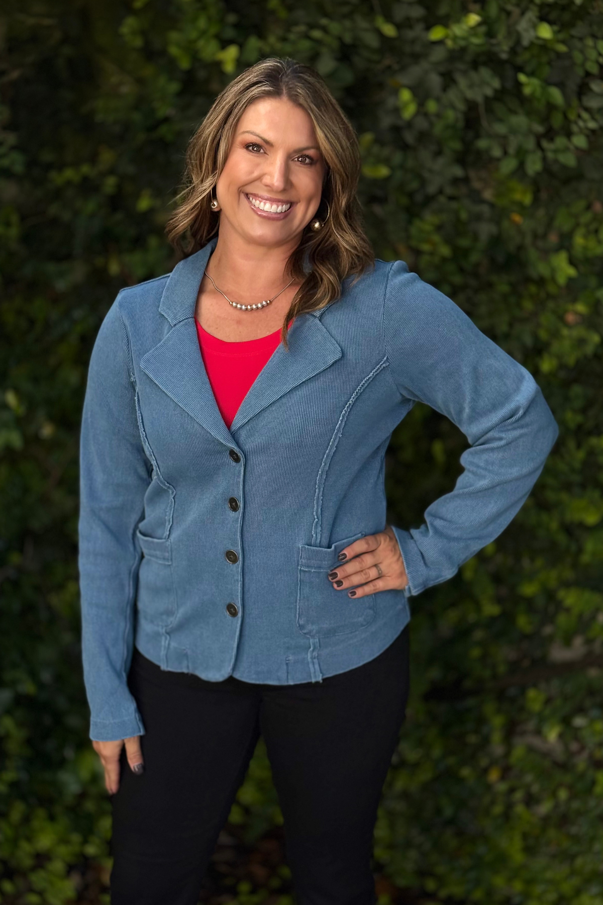 Woman wearing The Coastal Knit Blazer in soft blue — casual knit blazer with lapels and button front.