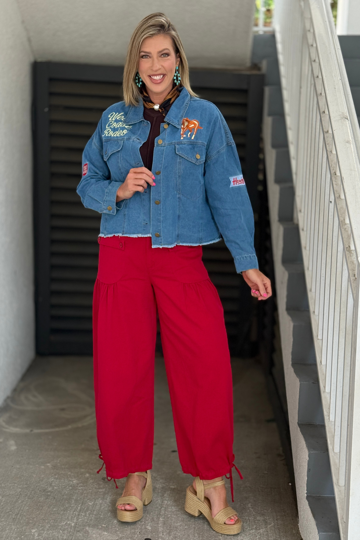 Medium wash embroidered jean jacket.