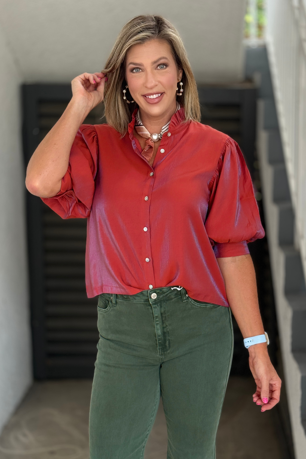 Women's ruffle neck button blouse.