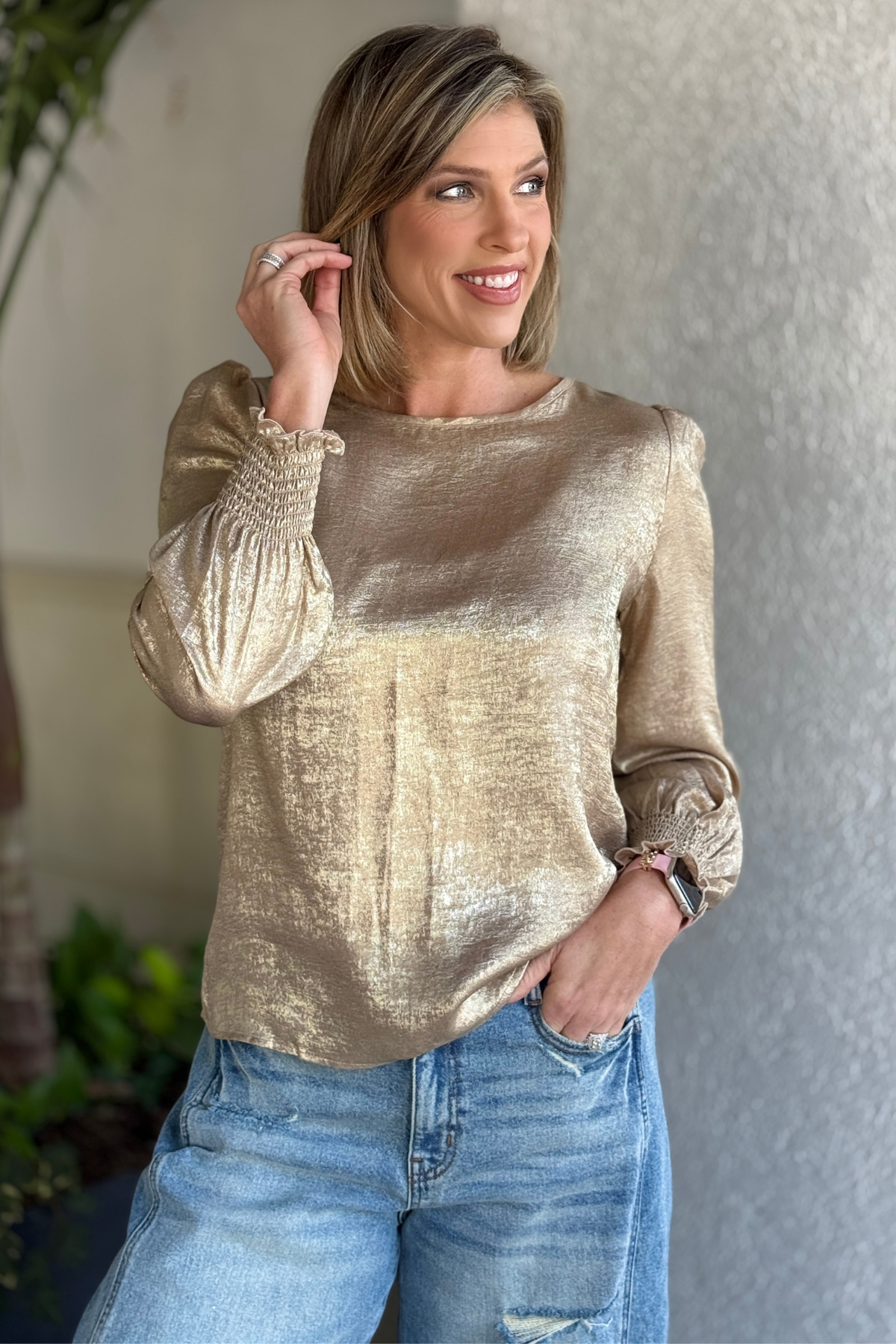 Side view of gold round neck boutique blouse