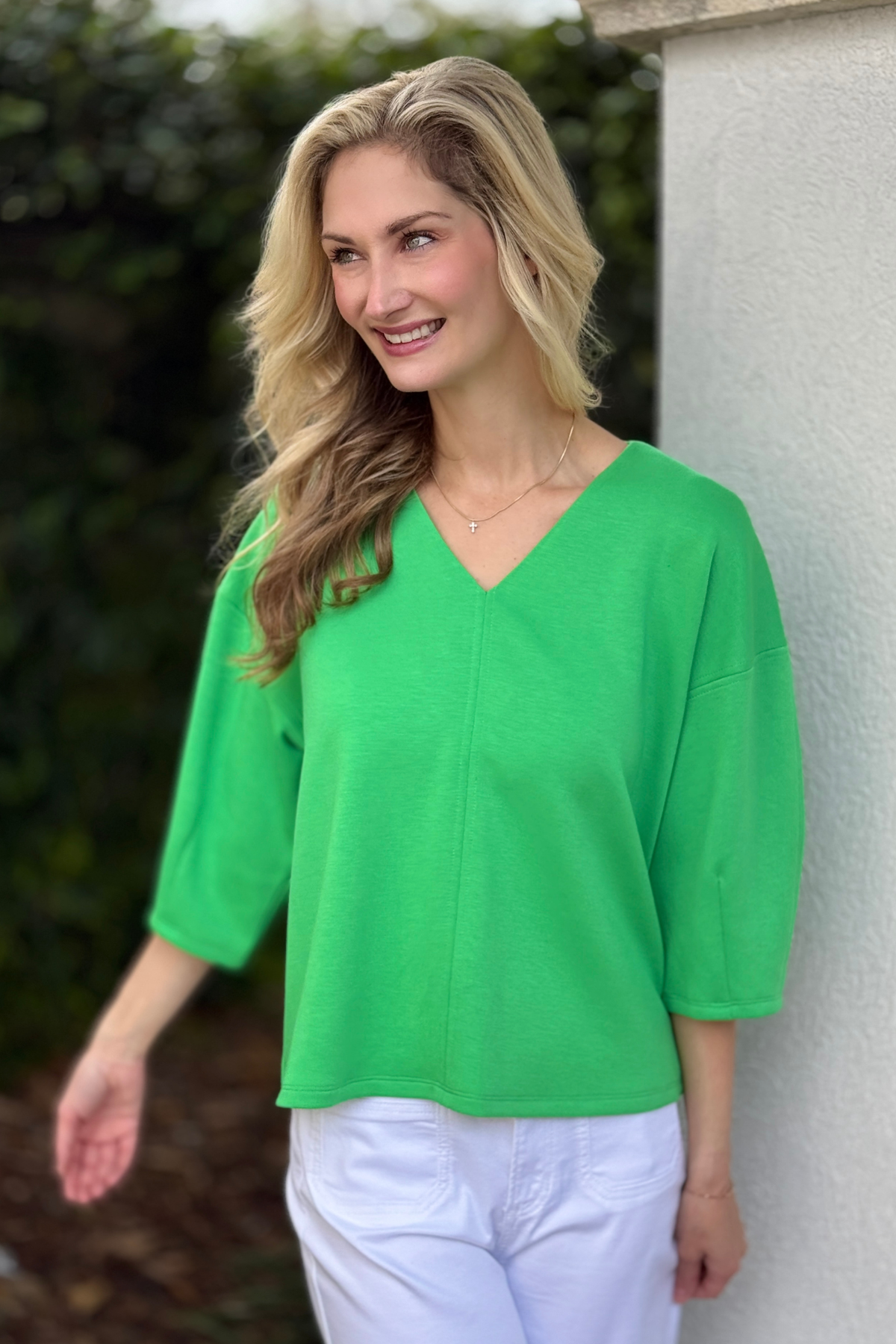 Side view of green drop shoulder spring blouse
