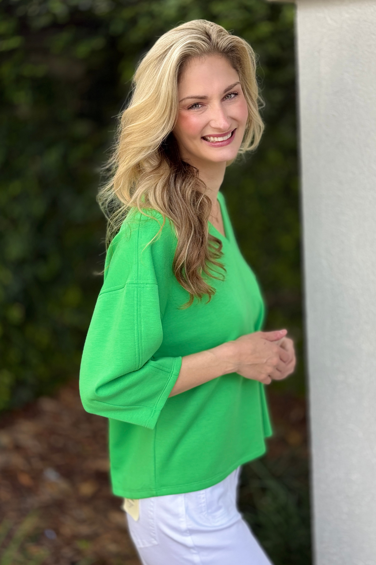 Women’s St Patricks Day green boutique top styled with white jeans