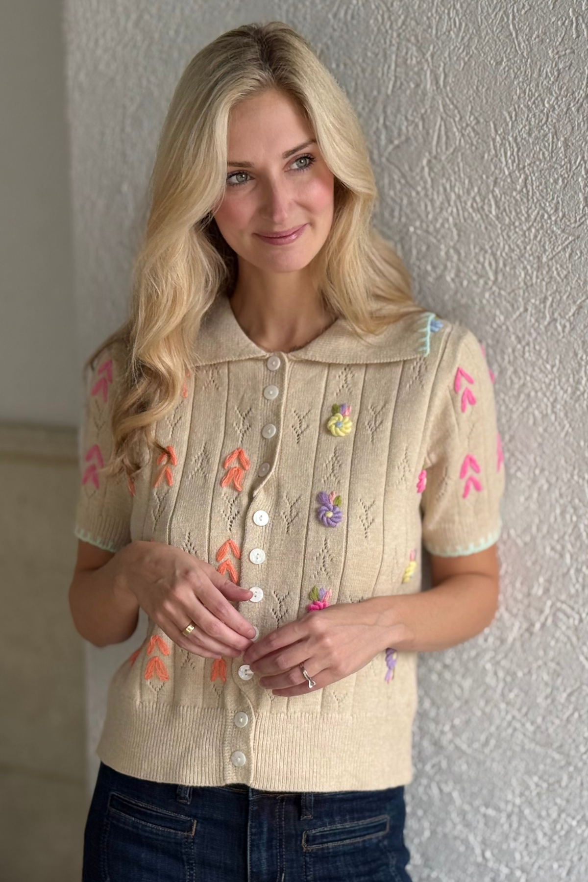 Pointelle knit button down sweater styled with jeans