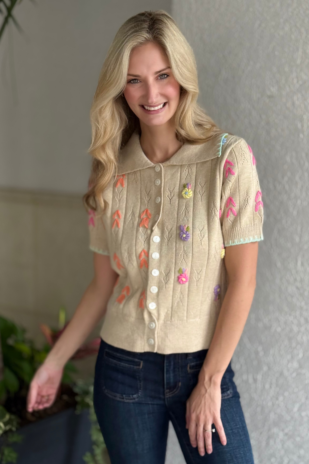 Beige short sleeve sweater with colorful floral details