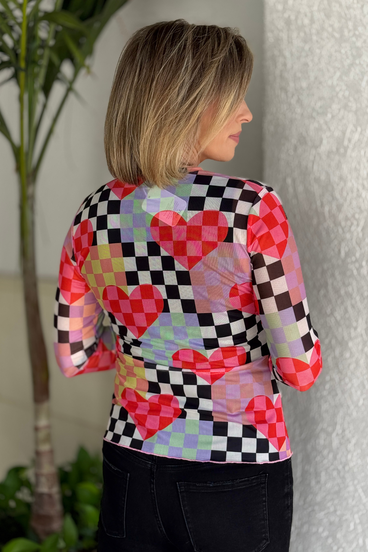 close up of multicolor checkerboard heart mesh fabric texture