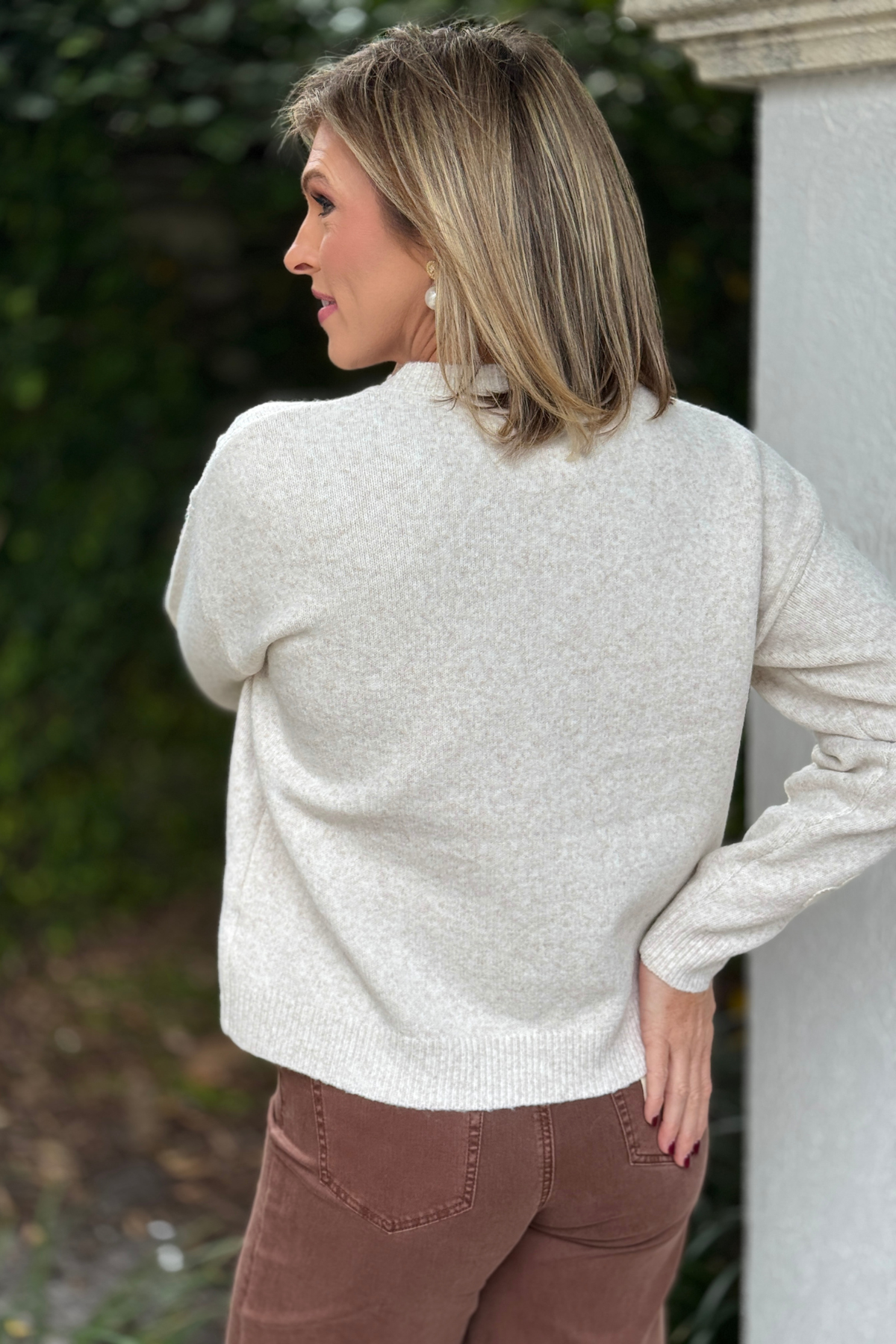 Relaxed crew neck sweater with embroidered floral sleeves