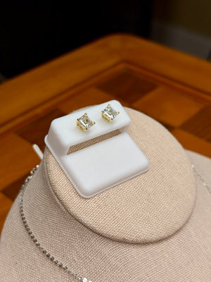 square moissanite stud earrings on display stand