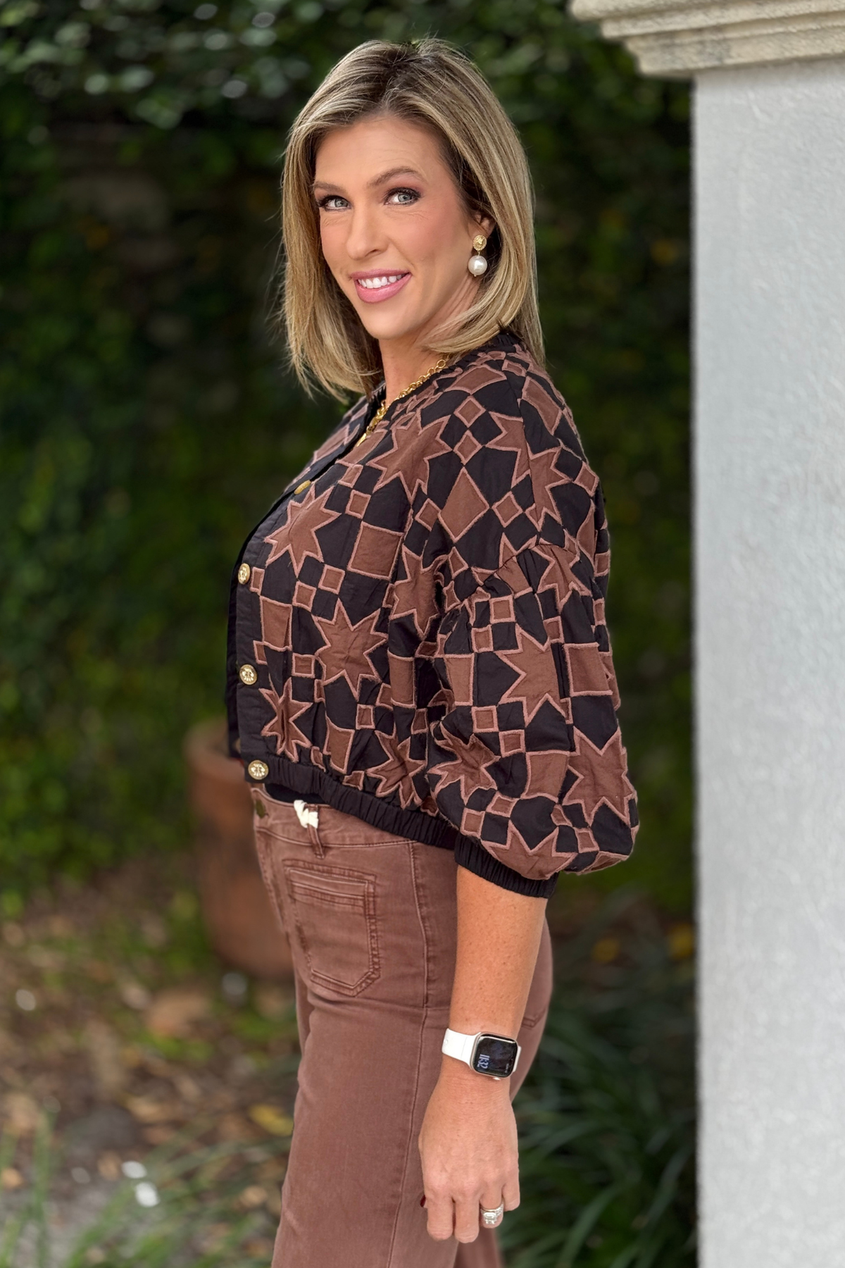 Back view of Ivy Jane brown and black star jacket