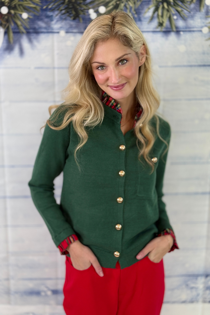 Women’s green holiday cardigan with red plaid collar and cuffs