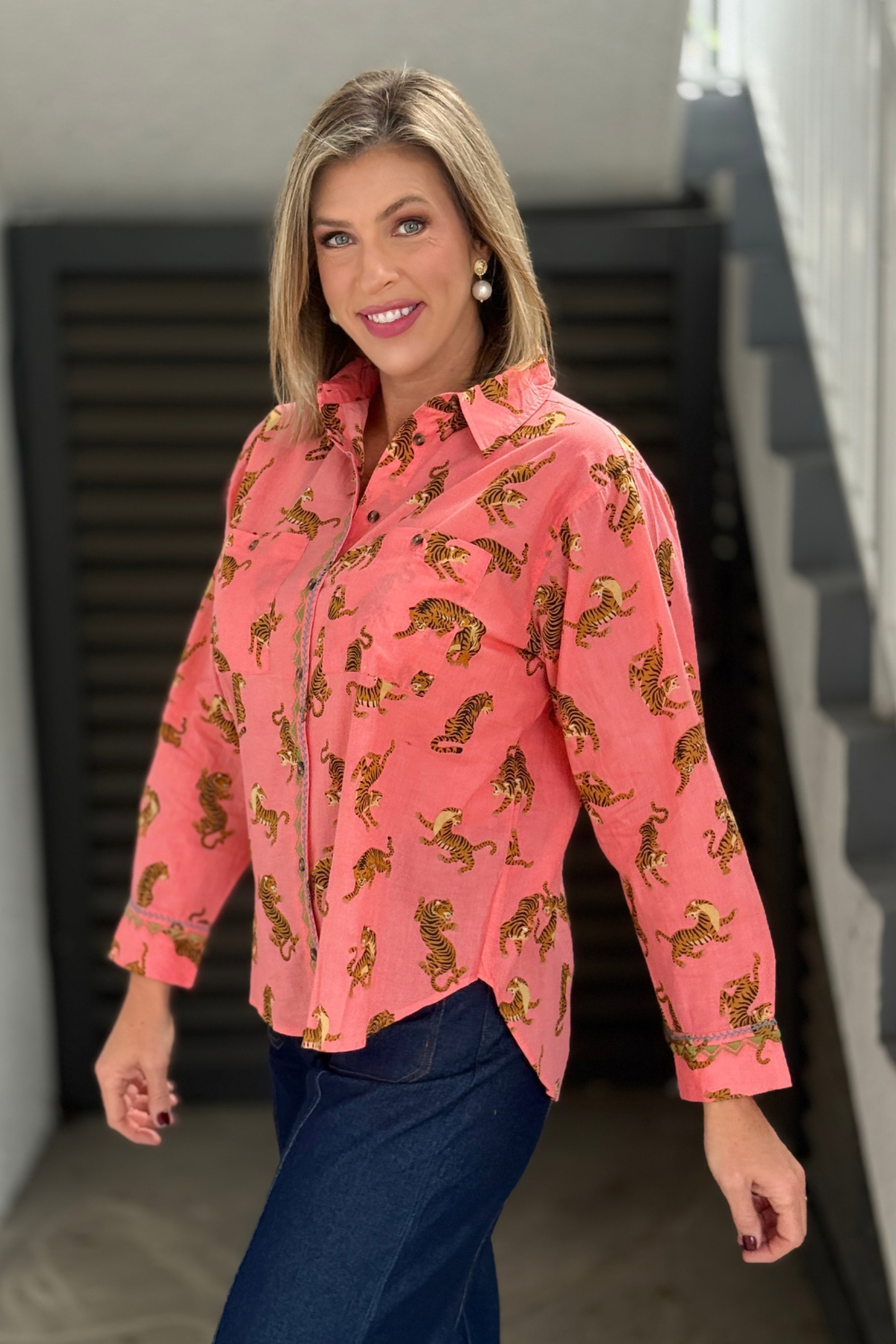 Back view of pink tiger print button down blouse