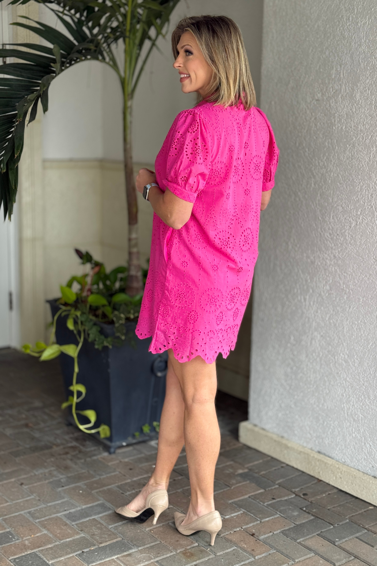 Back view of pink button down eyelet dress