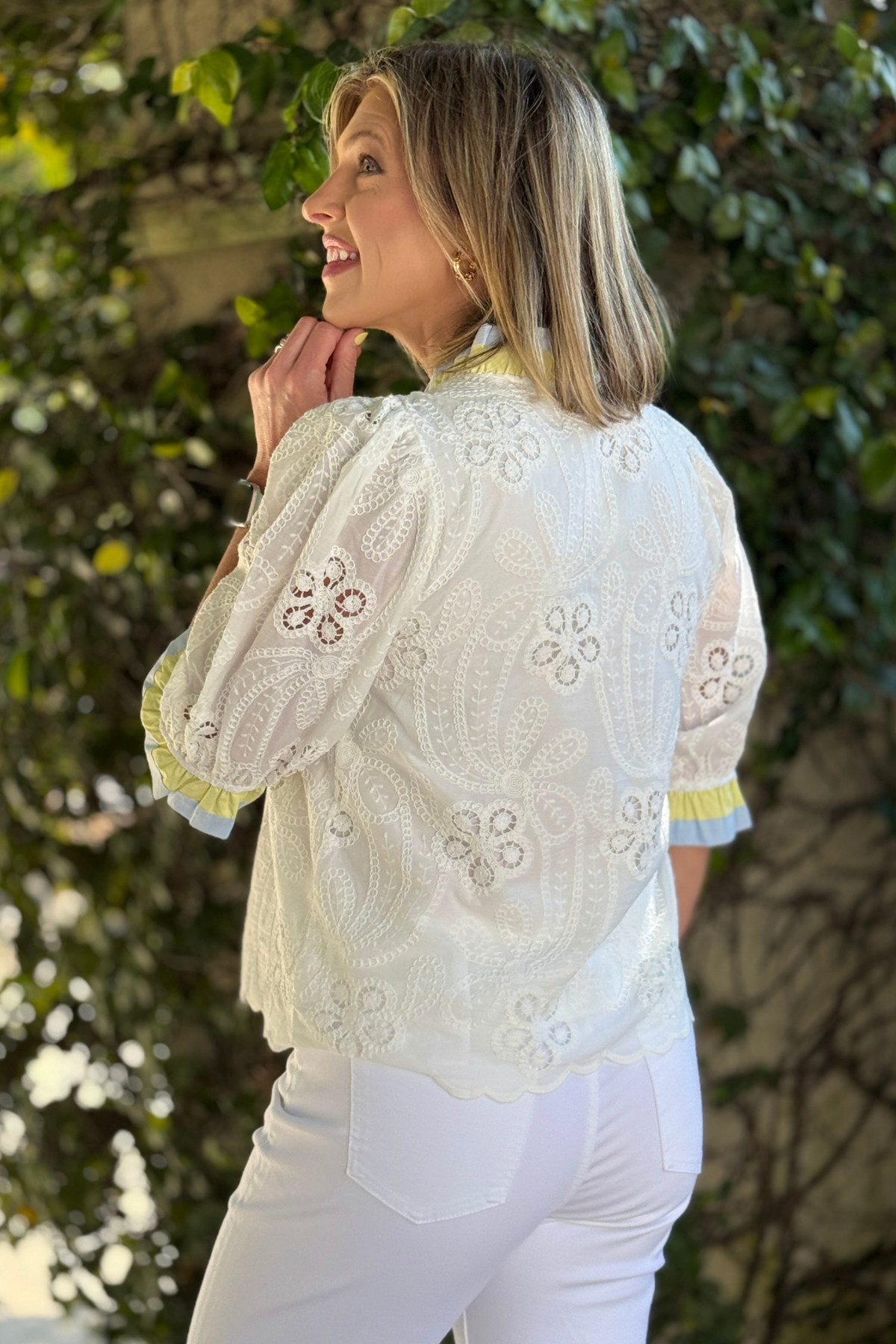 Feminine spring blouse with embroidered eyelet fabric and button front