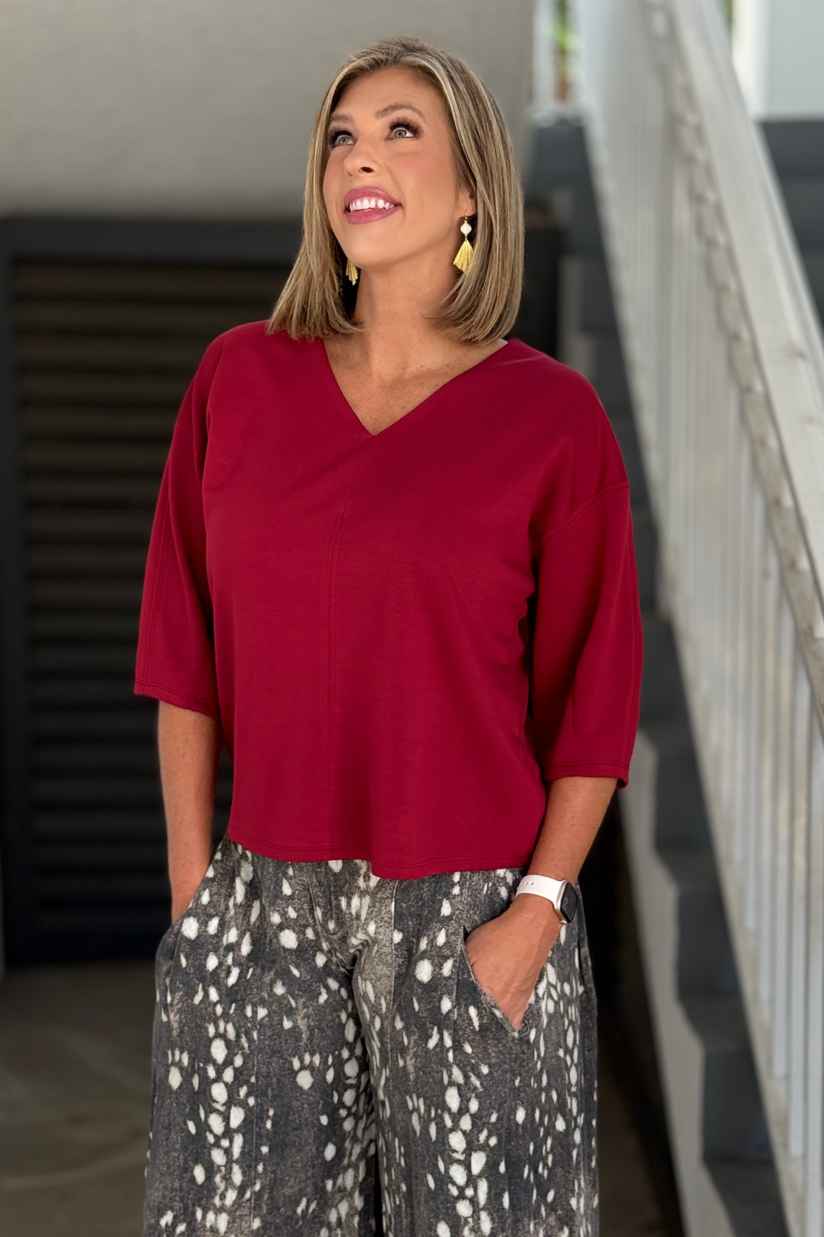 Burgundy loose fit V-neck top with center seam