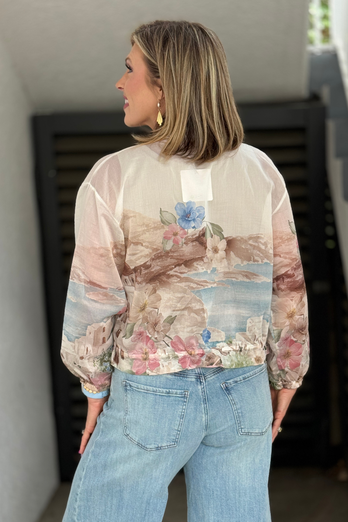 Relaxed fit drawstring hem jacket with dolman sleeves and zip front closure