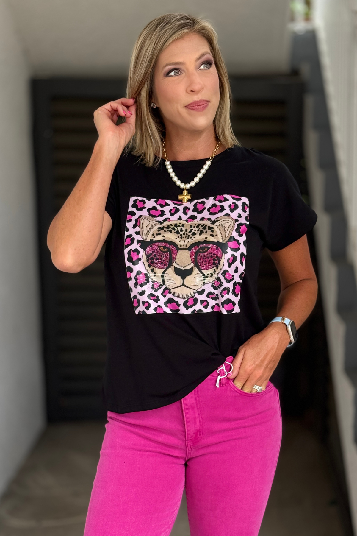 Women's leopard graphic tee with pink sunglasses