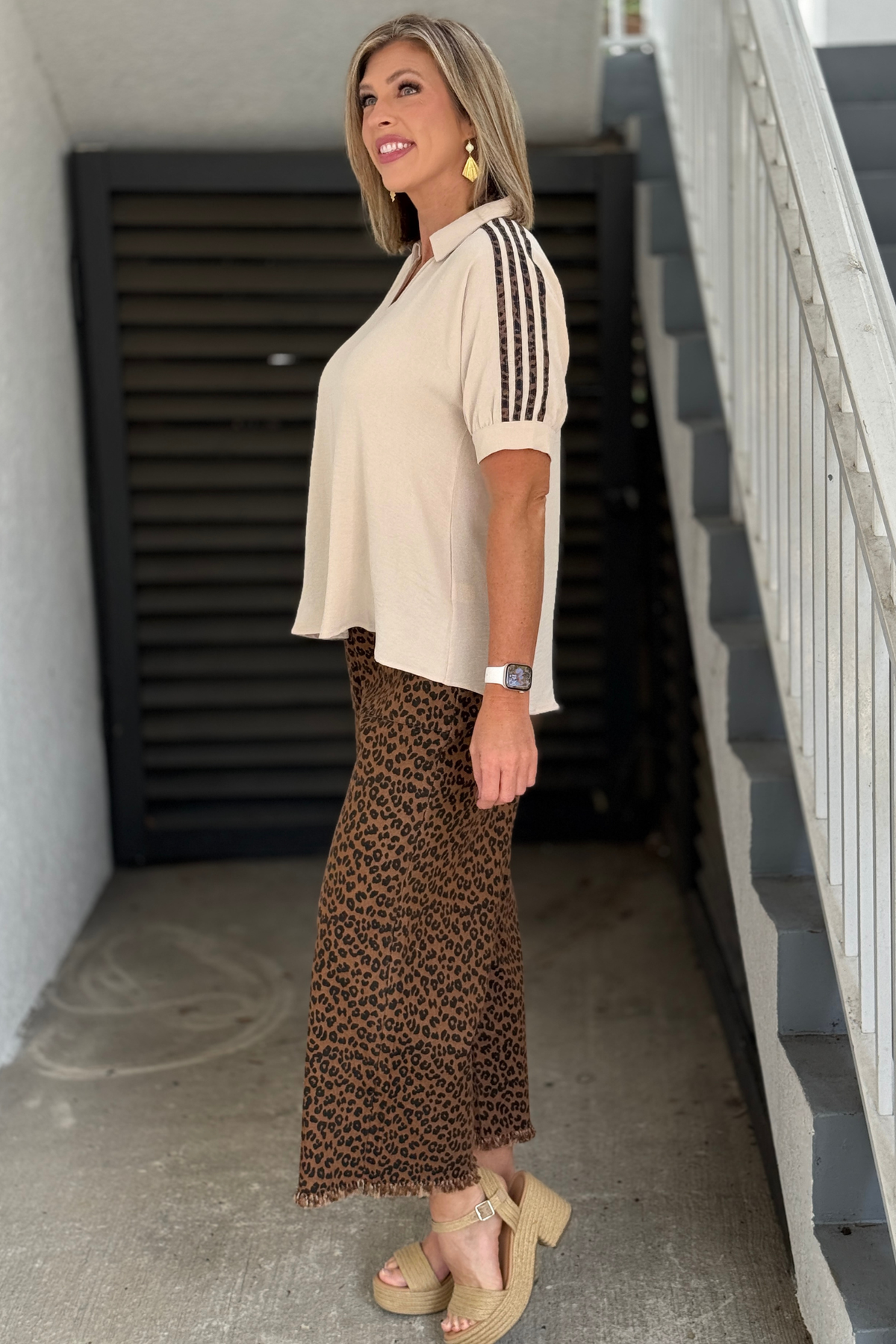 Cream boutique blouse styled with leopard print pants