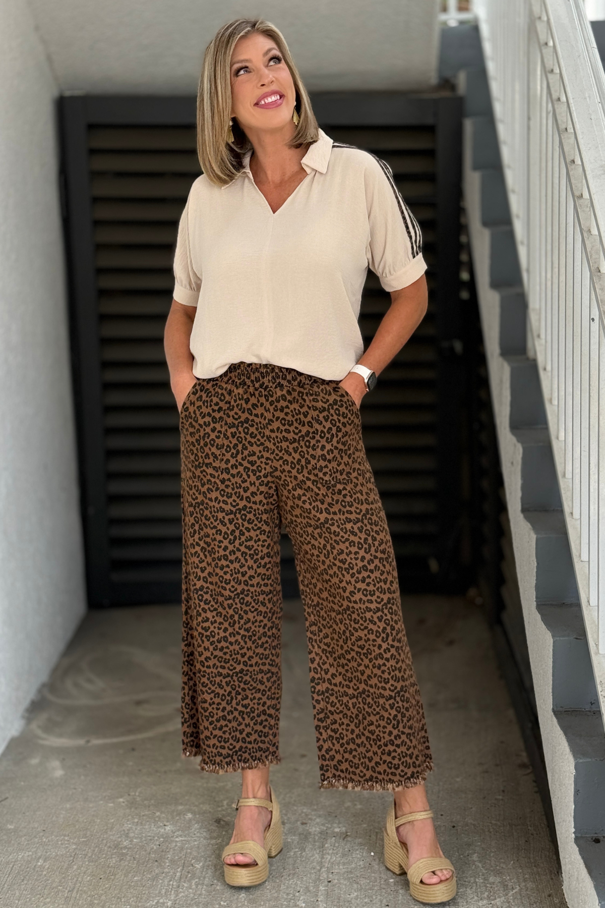 Brown and black leopard print wide leg pants with raw hem