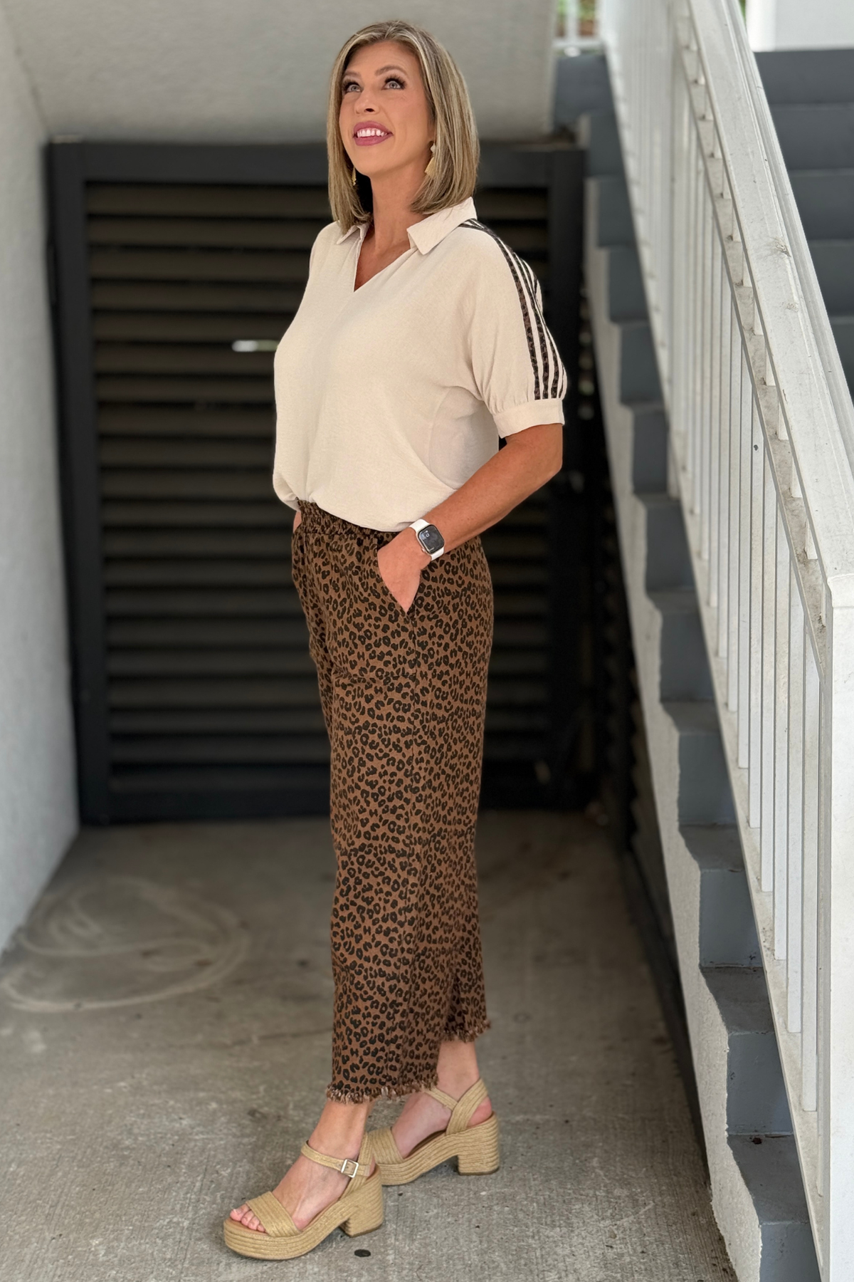 Boutique leopard print pants styled with black ankle boots